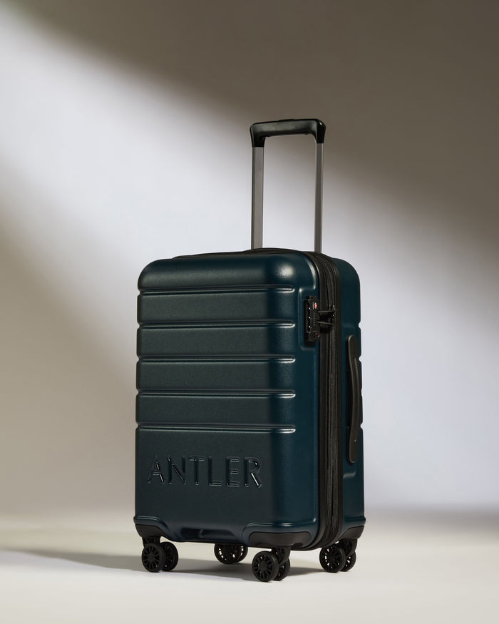 a blue suitcase with wheels