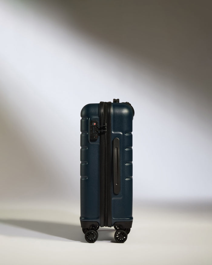 a blue suitcase with wheels