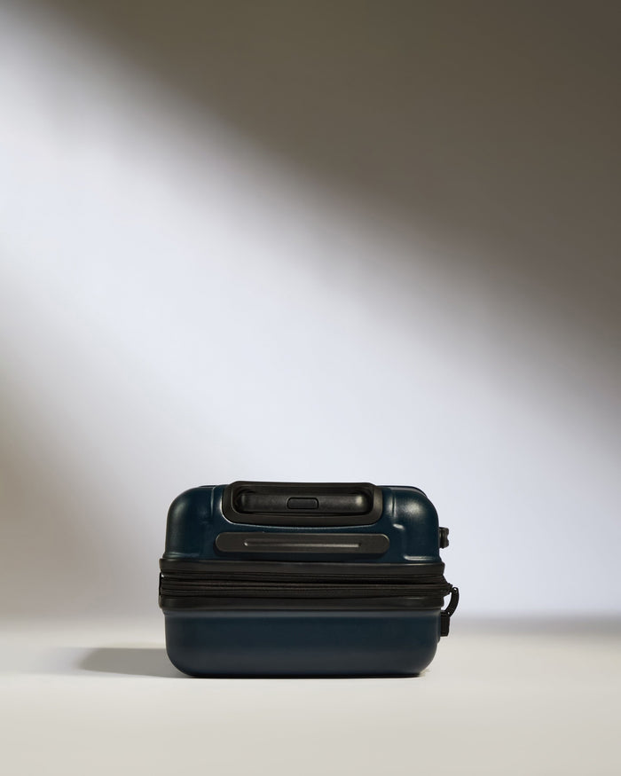 a blue suitcase with a zipper