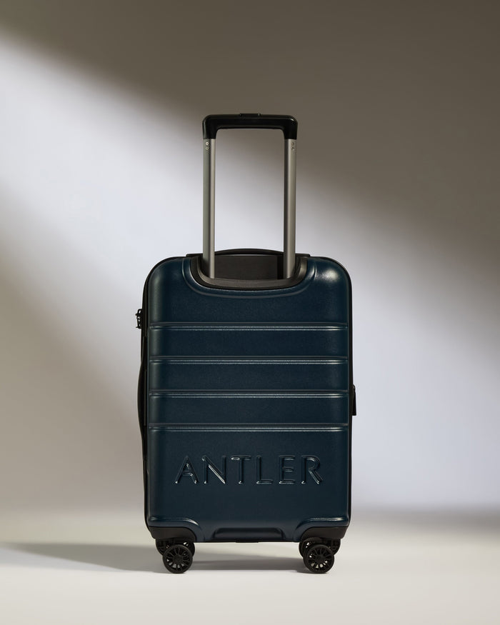 a blue suitcase with handle