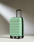 a light green suitcase with wheels