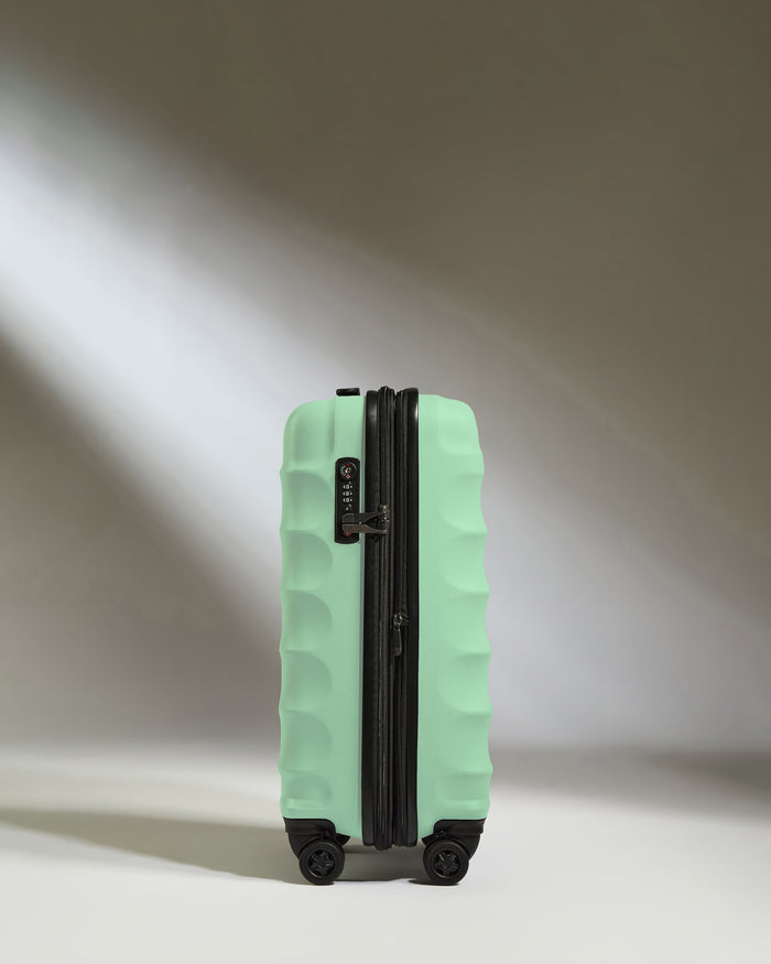 a suitcase with wheels and light shining through it