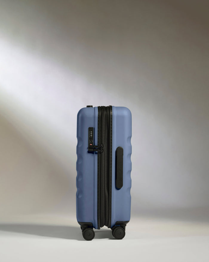 a blue suitcase with wheels