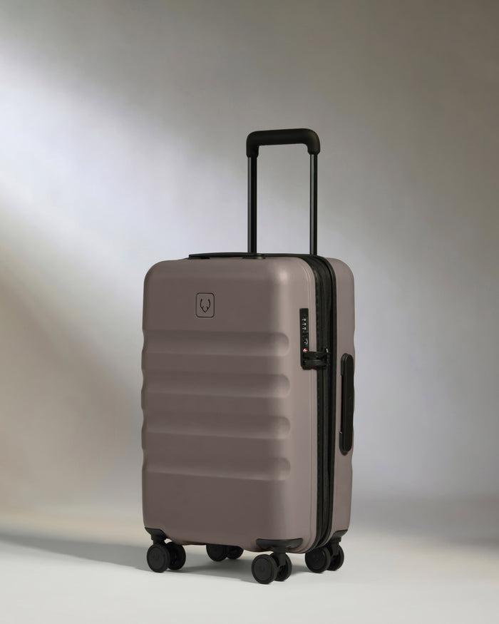 a grey suitcase with wheels