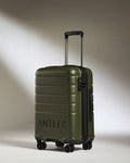 a green suitcase with wheels