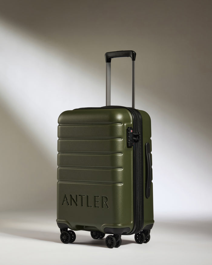 a green suitcase with wheels