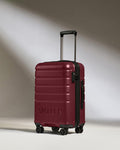 a red suitcase with wheels