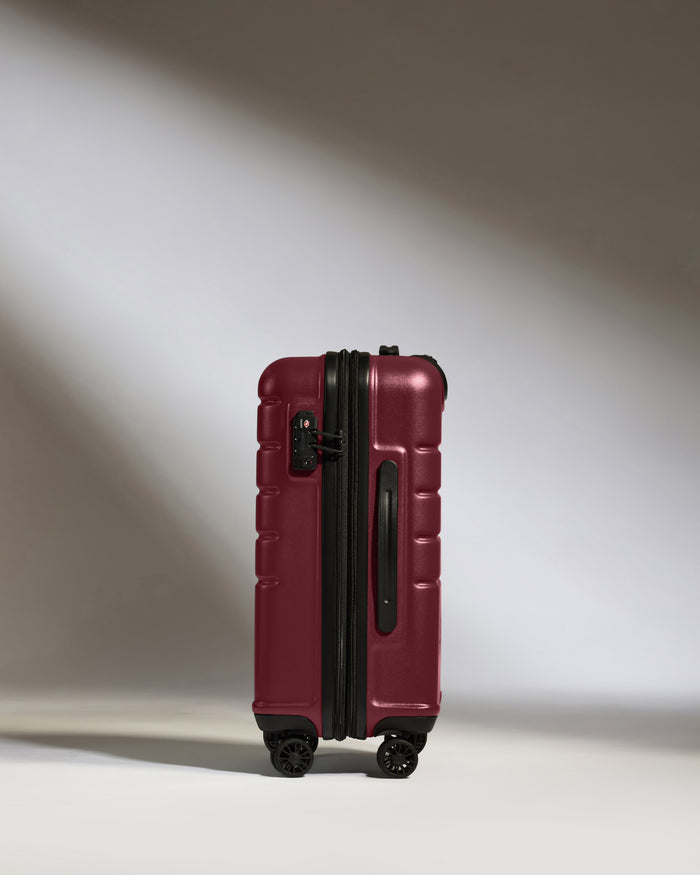 a red suitcase with wheels