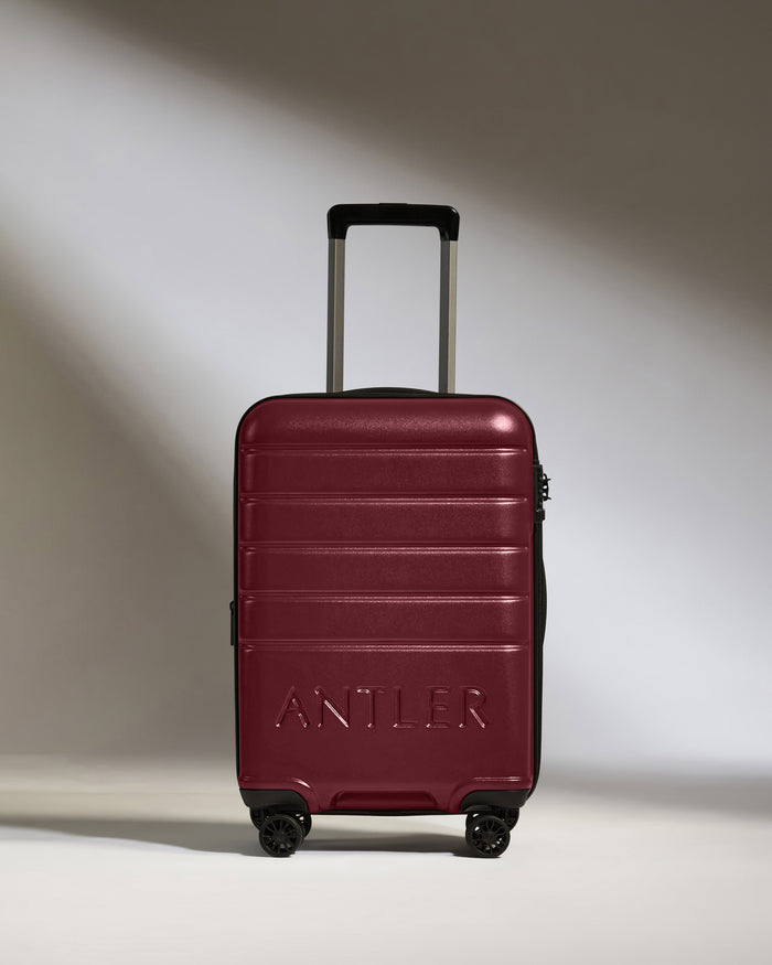 a red suitcase with wheels