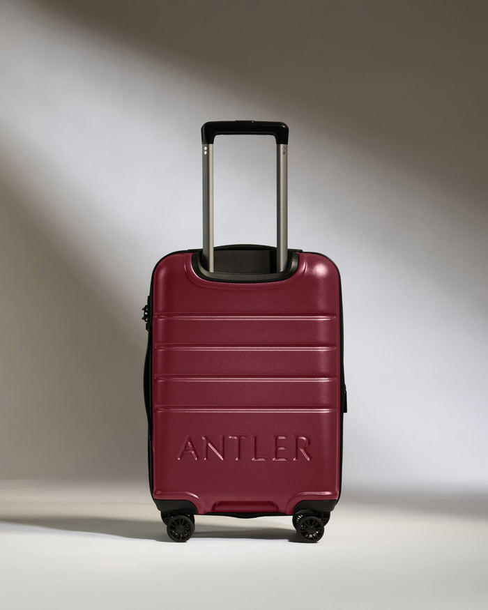 a red suitcase with handle