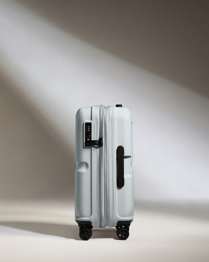a suitcase with wheels and light shining on it