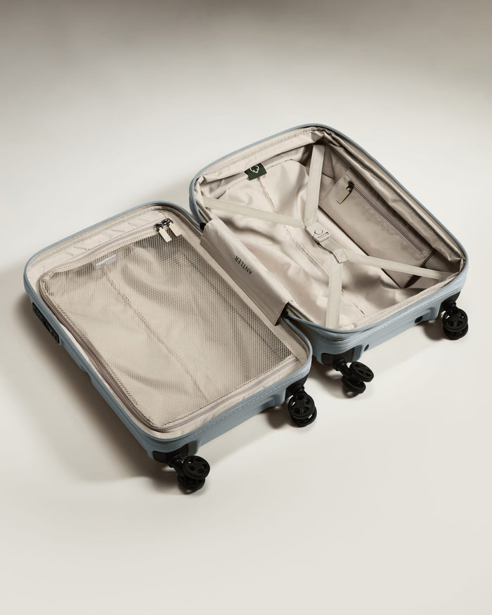 a suitcase with wheels and a mesh inside