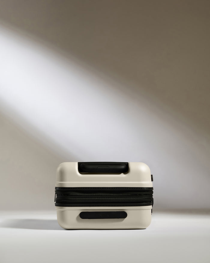 a white and black suitcase