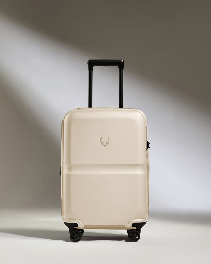 a white suitcase with black wheels