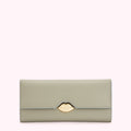 Sage green leather wallet with gold lip clasp against a white background.