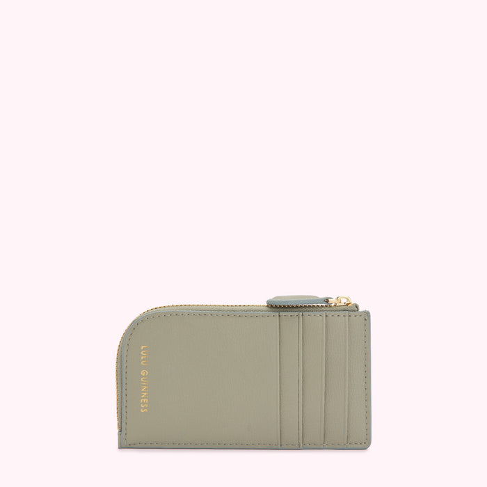 Sage green cardholder with gold zipper and Lulu Guinness logo.