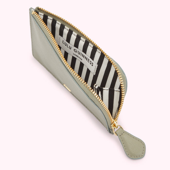 Sage green Lulu Guinness zip-around cardholder with black and white striped interior.
