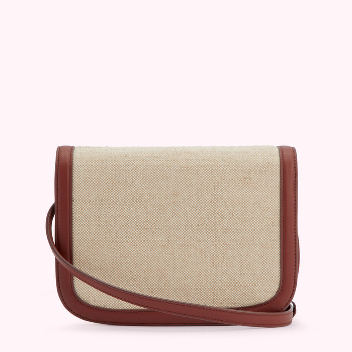 Beige canvas crossbody bag with brown leather trim and strap.