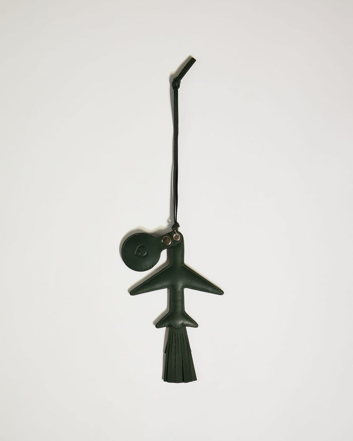 a green leather keychain with a round ball