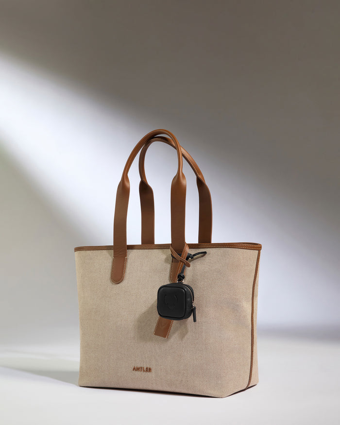 a bag with a keychain on it