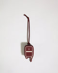a red luggage tag on a string