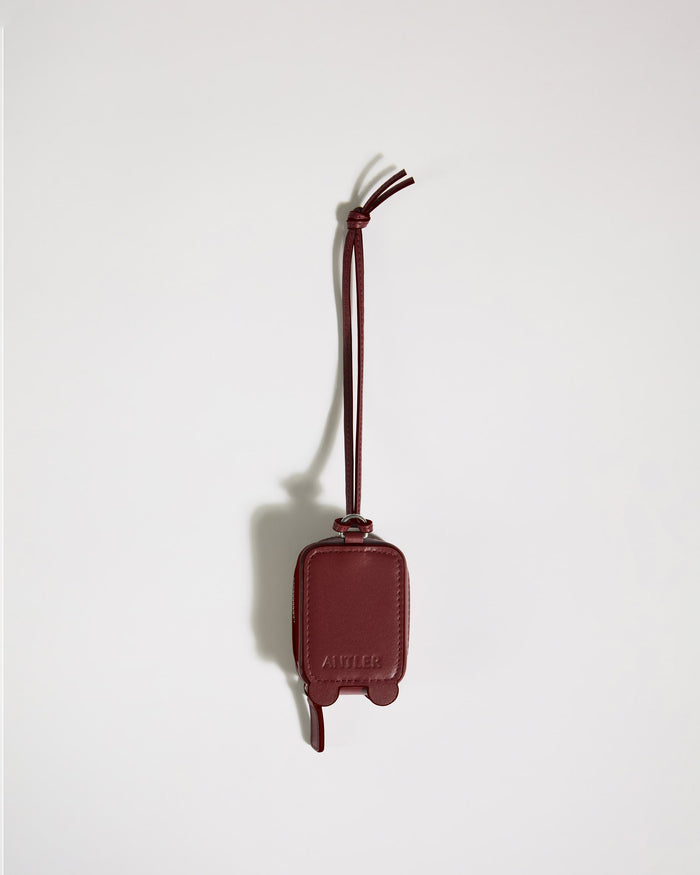 a red leather luggage tag