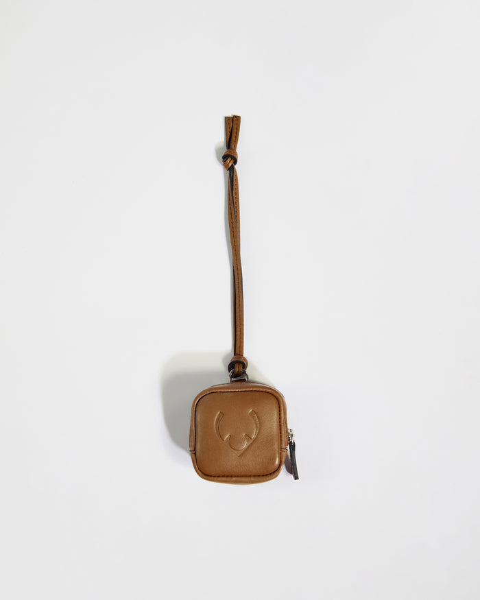 a brown leather case with a small logo on it