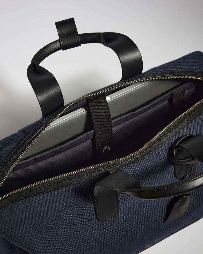 a blue bag with black straps