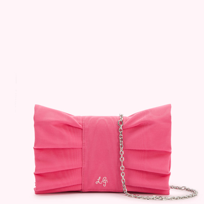 Pink pleated bow clutch with silver chain strap.