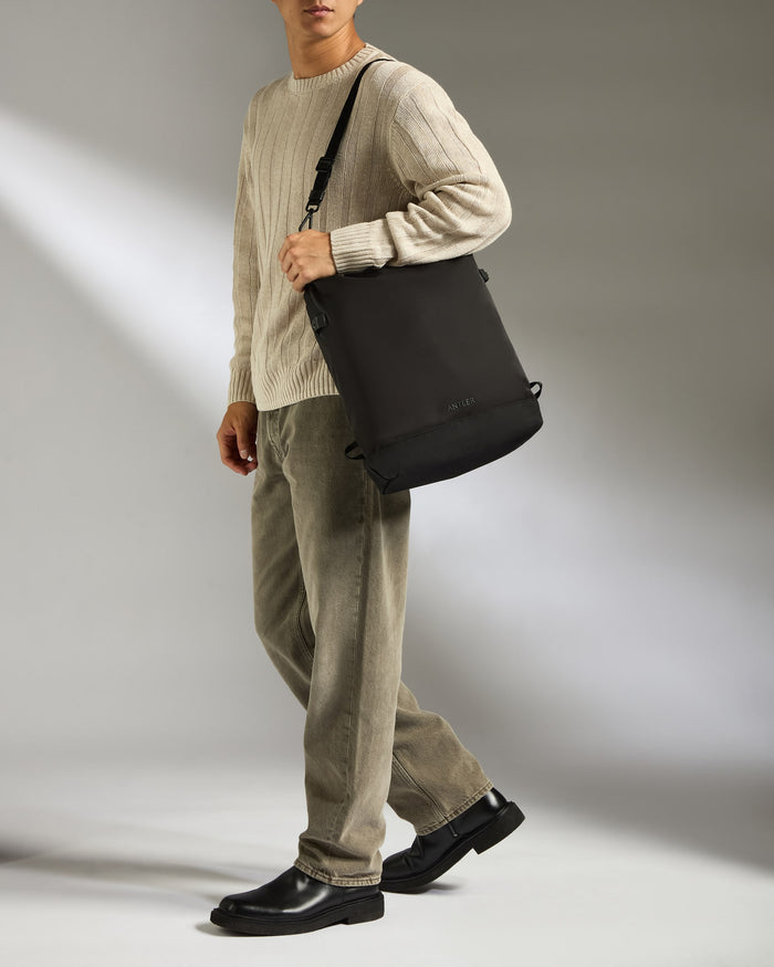 a man walking with a bag