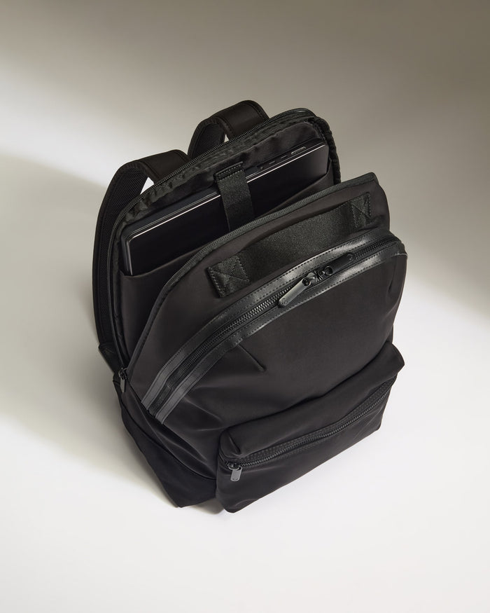 a black backpack with a tablet inside