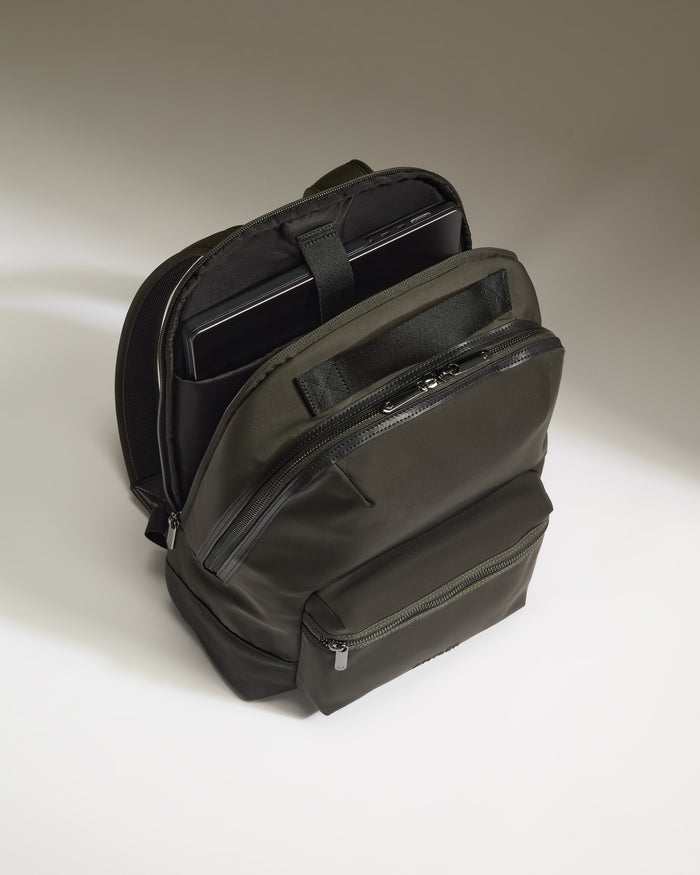 a black backpack with a tablet inside