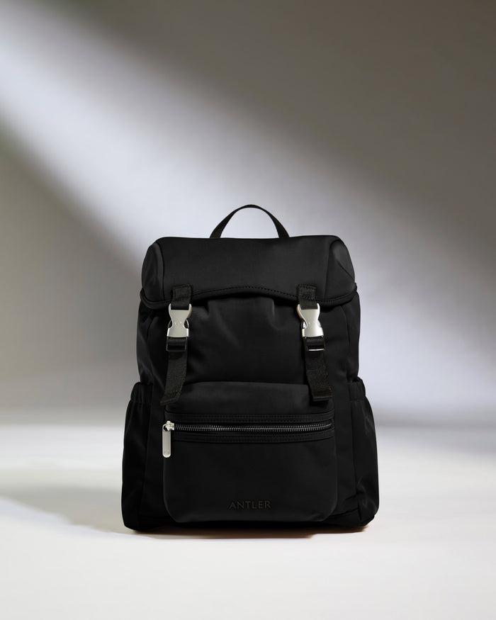 a black backpack with a white background