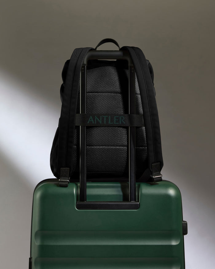 a green and black backpack