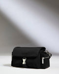 a black bag on a white surface