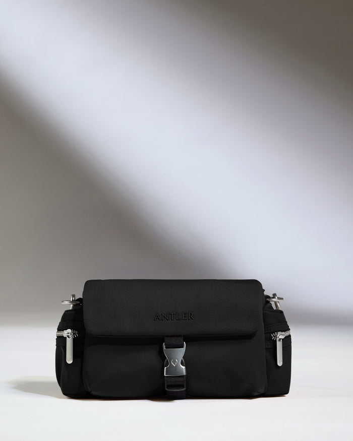 a black bag with silver zippers