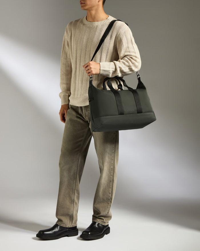 a man holding a bag