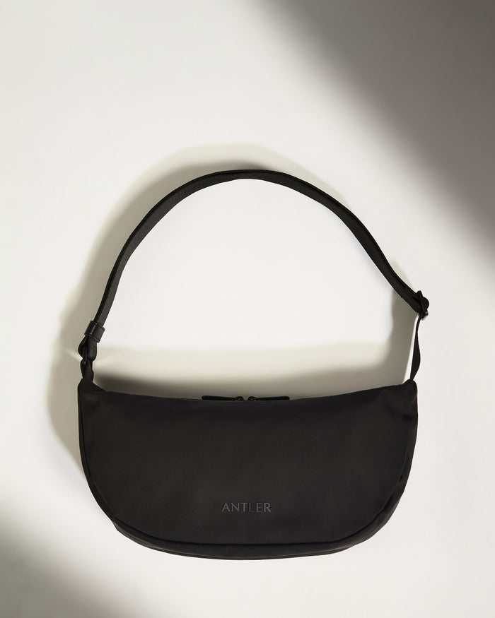 a black bag on a white surface
