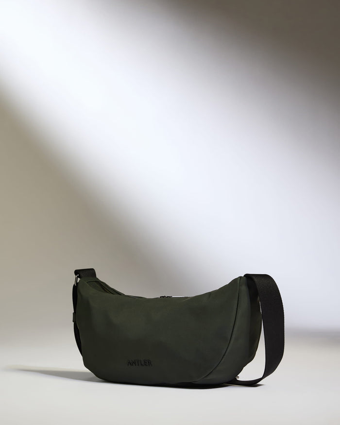 a green bag with a strap