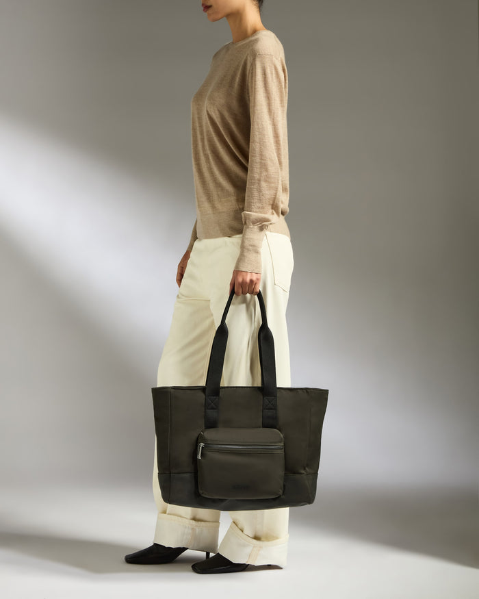 a woman holding a bag