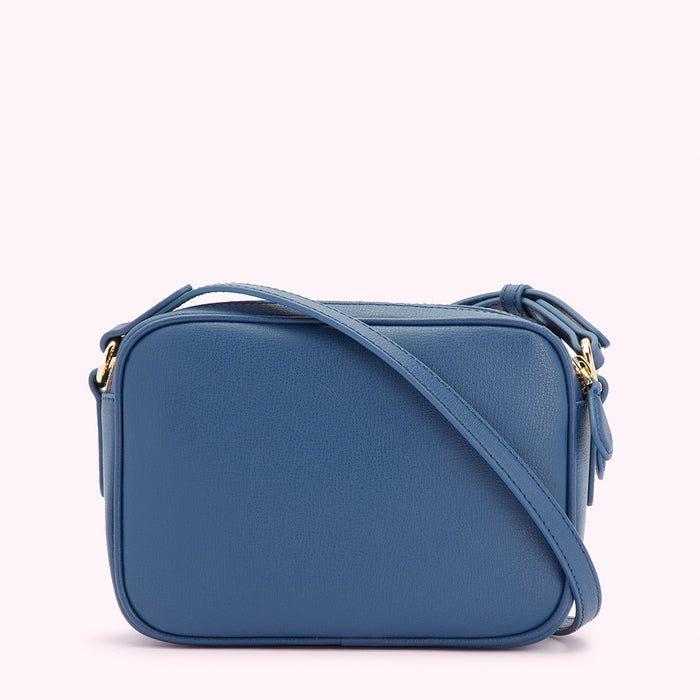 A blue leather crossbody bag with gold hardware.