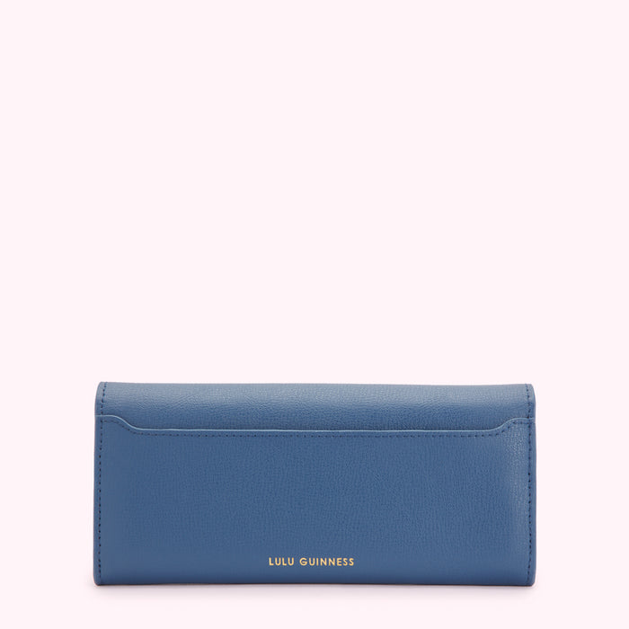 Rear view of a blue Lulu Guinness wallet against a white background.