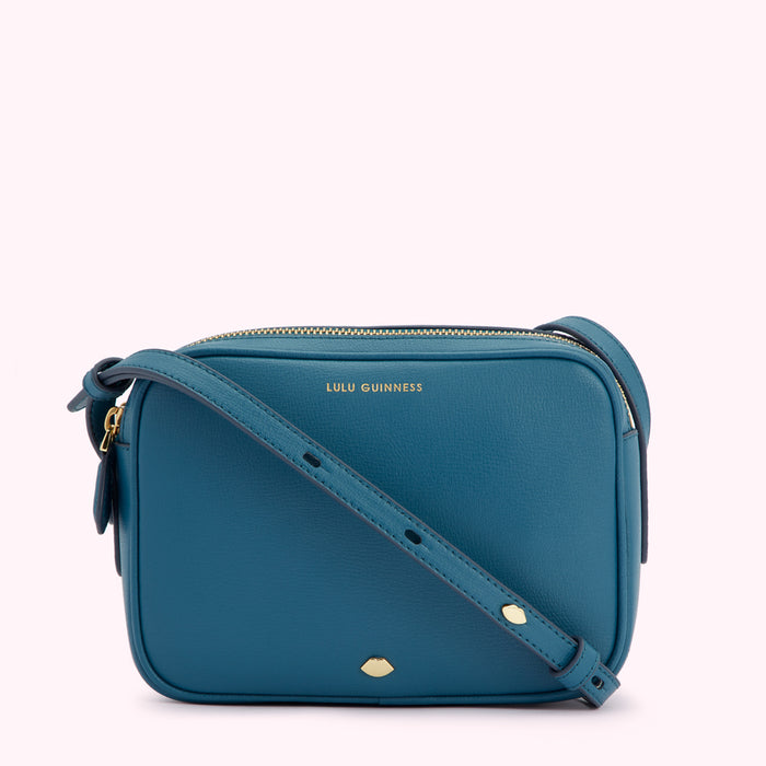 Teal blue Lulu Guinness crossbody bag with gold zipper and hardware.