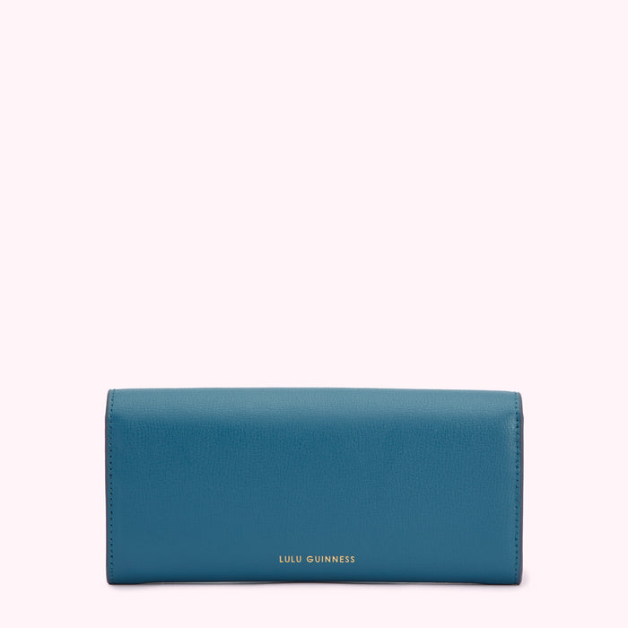 Teal Lulu Guinness wallet on white background.