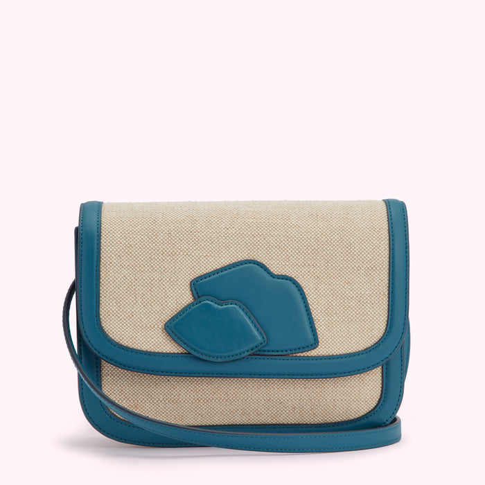 Beige canvas crossbody bag with teal leather trim and lips detail.