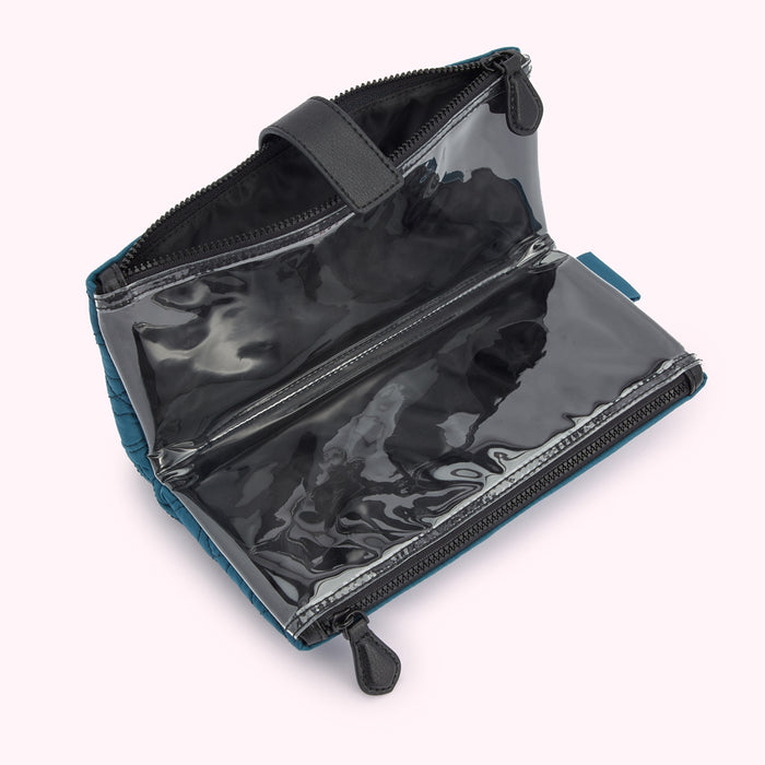 Teal quilted zipper pouch with clear compartments open to reveal the interior.
