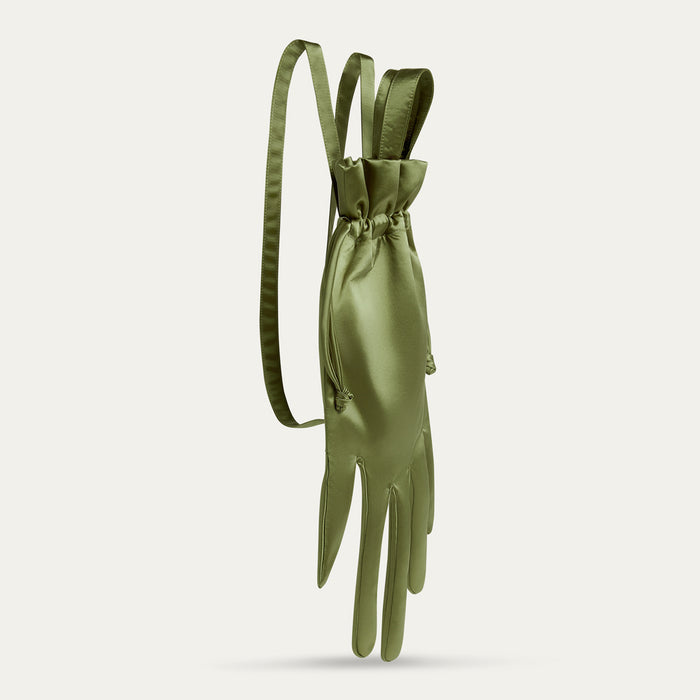Green satin hand shaped backpack with a drawstring on a light gray background