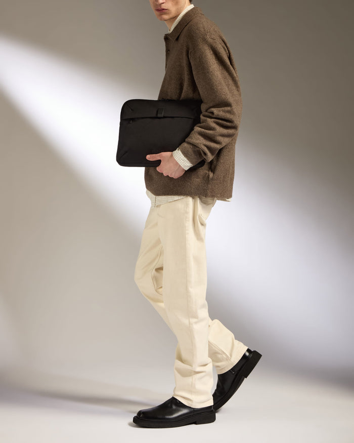 a man walking with a bag