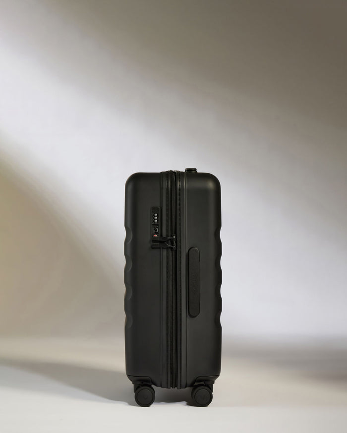 a black suitcase with wheels