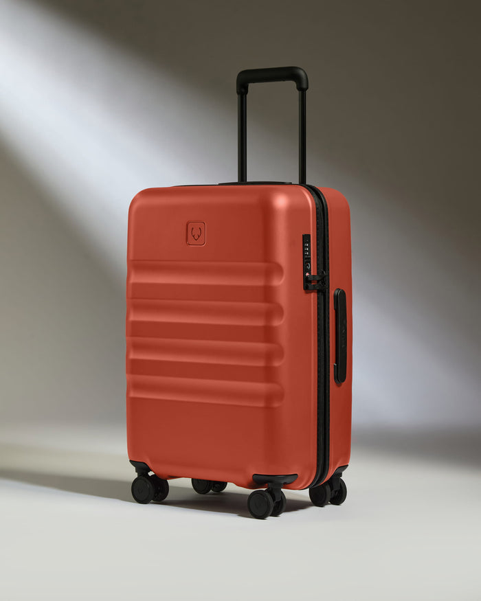 a red suitcase with wheels